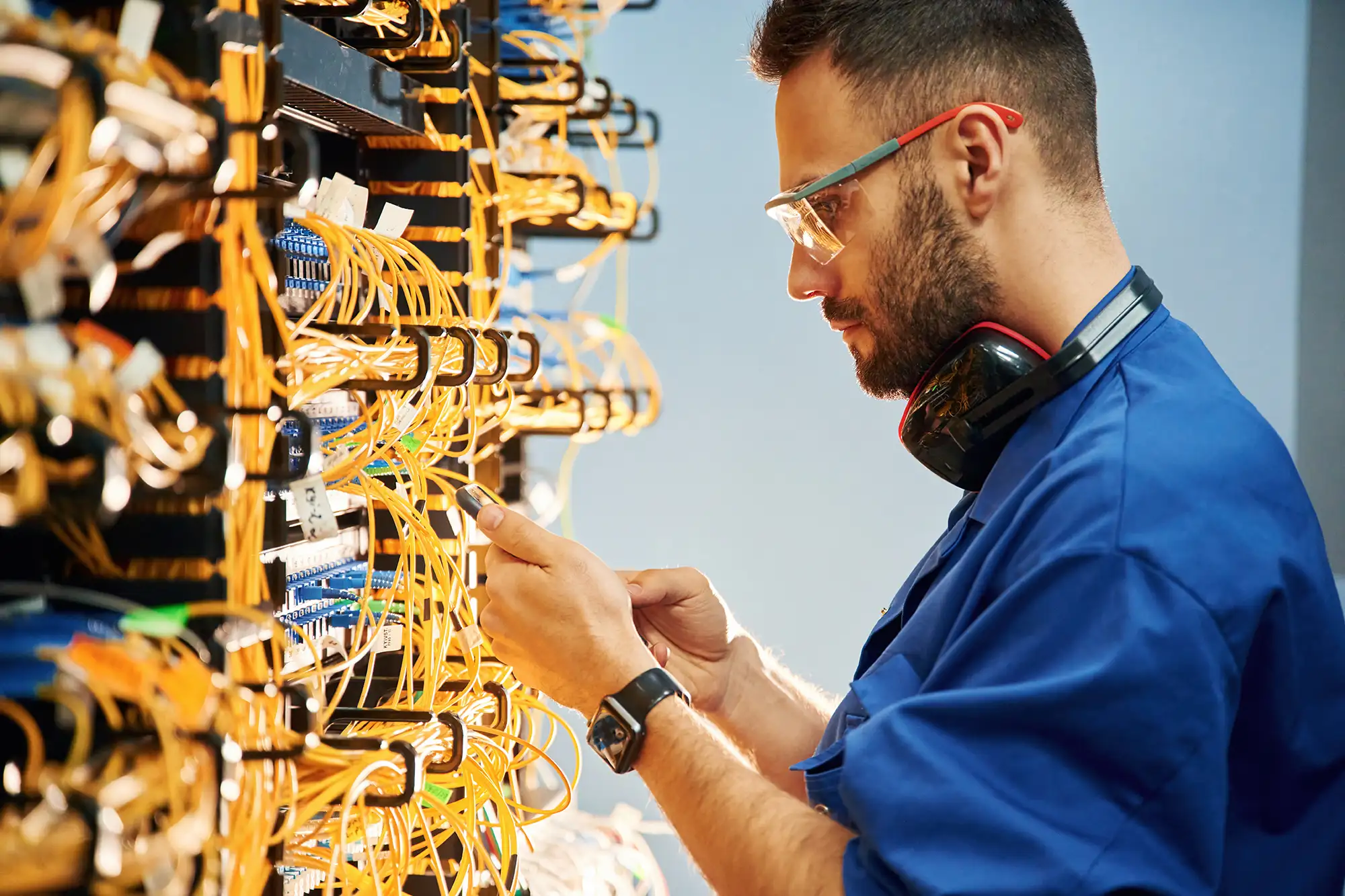 Field technician inspecting fiber terminations